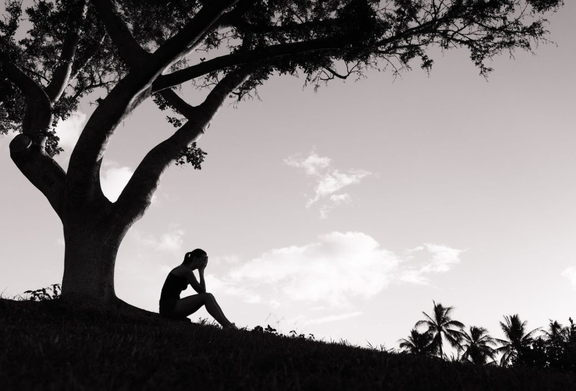 person under a tree